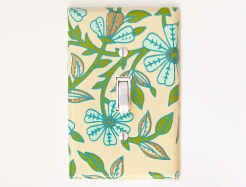 Teal Flowers cover this Cream colored Single Toggle Switch Plates, with Green and Gold Leaves by The Orange Chair Studio.